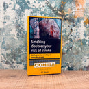 Cohiba Short Cigars package with health warning label on a textured surface